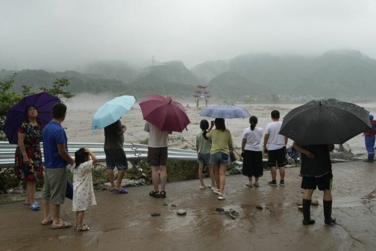 At least 20 dead and 27 missing in floods surrounding China's capital Beijing, thousands evacuated