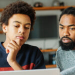 student and parent using computer