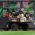 Aug 23, 2023; Bronx, New York, USA; Washington Nationals left fielder Stone Garrett (36) is driven off the field after an injury during the seventh inning against the New York Yankees at Yankee Stadium.