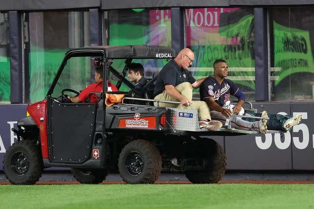 Aug 23, 2023; Bronx, New York, USA; Washington Nationals left fielder Stone Garrett (36) is driven off the field after an injury during the seventh inning against the New York Yankees at Yankee Stadium.