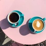 Morning coffees on pink table