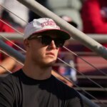 STANFORD, CALIFORNIA - SEPTEMBER 23: Christian McCaffrey of the San Francisco 49ers watches the game between the Arizona Wildcats and Stanford Cardinal at Stanford Stadium on September 23, 2023 in Stanford, California. (Photo by Loren Elliott/Getty Images)