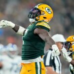 GREEN BAY, WISCONSIN - SEPTEMBER 28: Quay Walker #7 of the Green Bay Packers reacts against the Detroit Lions during the third quarter in the game at Lambeau Field on September 28, 2023 in Green Bay, Wisconsin. (Photo by Patrick McDermott/Getty Images)