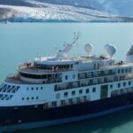 A view of the Ocean Explorer, a Bahamas-flagged Norwegian cruise ship with 206 passengers and crew, which has run aground in northwestern Greenland is pictured on Tuesday, Sept. 12, 2023. The 104.4-meter (343-foot) long and 18-meter (60 foot) wide Ocean Explorer ran aground on Monday in Alpefjord in the Northeast Greenland National Park. Another attempt to pull free a luxury cruise ship with 206 people that ran aground in the world???s northernmost national park has failed by using the high tide. It was the third attempt to free the MV Ocean Explorer. (SIRIUS/Joint Arctic Command via AP)