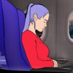 Woman holding tummy on plane