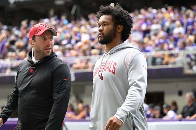 Aug 26, 2023; Minneapolis, Minnesota, USA; Arizona Cardinals quarterback Kyler Murray (right) walks onto the field at  U.S. Bank Stadium before the game between the Minnesota Vikings and the Arizona Cardinals.