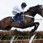 Constitution Hill and Nico De Boinville jump the last in the Aintree Hurdle