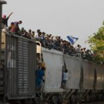 Mexican railway operator halts trains because so many migrants are climbing aboard and getting hurt