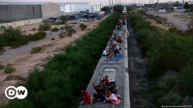 Mexico railway firm stops trains as migrants hitch rides