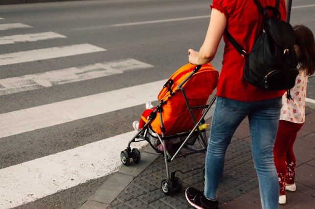 Mother with her children on crosswalk