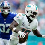 MIAMI GARDENS, FLORIDA - OCTOBER 08: Tyreek Hill #10 of the Miami Dolphins scores a touchdown against the New York Giants during the third quarter at Hard Rock Stadium on October 08, 2023 in Miami Gardens, Florida. (Photo by Rich Storry/Getty Images)