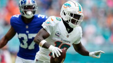 MIAMI GARDENS, FLORIDA - OCTOBER 08: Tyreek Hill #10 of the Miami Dolphins scores a touchdown against the New York Giants during the third quarter at Hard Rock Stadium on October 08, 2023 in Miami Gardens, Florida. (Photo by Rich Storry/Getty Images)