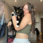 Katie and her cat Winston. Release date - 31/10/23. See SWNS story SWLNcat. A cat has been reunited with its owner after disappearing for 40 days - and needs ?7K worth of treatment at the vet. Katie Carr, 24, a student at the University of York, was living at her parents? home in Manchester with her pet Winston when he escaped through a window. Distraught at the thought of losing her beloved pet, Katie enlisted the help of a professional pet detective at a cost of nearly ?900. Despite three days of his best efforts he was unable to find Winston.