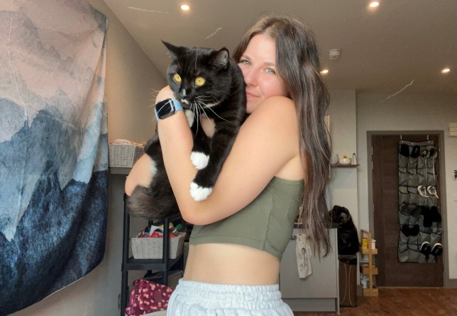 Katie and her cat Winston. Release date - 31/10/23. See SWNS story SWLNcat. A cat has been reunited with its owner after disappearing for 40 days - and needs ?7K worth of treatment at the vet. Katie Carr, 24, a student at the University of York, was living at her parents? home in Manchester with her pet Winston when he escaped through a window. Distraught at the thought of losing her beloved pet, Katie enlisted the help of a professional pet detective at a cost of nearly ?900. Despite three days of his best efforts he was unable to find Winston.