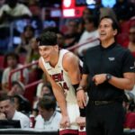 Miami Heat head coach Erik Spoelstra talks with guard Tyler Herro (14) during the second half of an NBA preseason basketball game, Sunday, Oct. 15, 2023, in Miami.