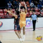 Mapua's Clint Escamis shoots over the Letran defense