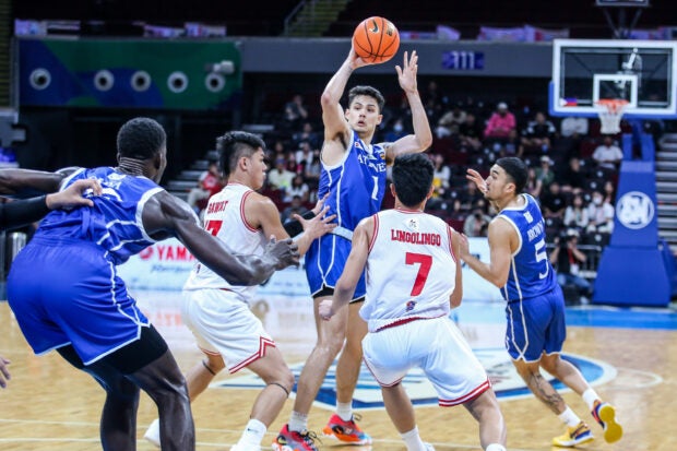 Ateneo's Kai Ballungay against UE defenders in the UAAP Season 86 men's basketball tournament. –MARLO CUETO/INQ