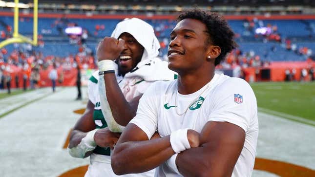 Breece Hall and Garrett Wilson celebrate after a rare Jets dub.