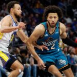 DETROIT, MICHIGAN - OCTOBER 30:  Cade Cunningham #2 of the Detroit Pistons dribbles on Stephen Curry #30 of the Golden State Warriors in the second half of the game at Little Caesars Arena on October 30, 2022 in Detroit, Michigan. NOTE TO USER: User expressly acknowledges and agrees that, by downloading and or using this photograph, User is consenting to the terms and conditions of the Getty Images License Agreement.  (Photo by Rick Osentoski/Getty Images)