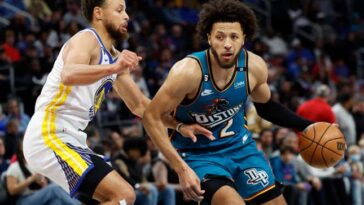 DETROIT, MICHIGAN - OCTOBER 30:  Cade Cunningham #2 of the Detroit Pistons dribbles on Stephen Curry #30 of the Golden State Warriors in the second half of the game at Little Caesars Arena on October 30, 2022 in Detroit, Michigan. NOTE TO USER: User expressly acknowledges and agrees that, by downloading and or using this photograph, User is consenting to the terms and conditions of the Getty Images License Agreement.  (Photo by Rick Osentoski/Getty Images)