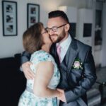 Portrait of a handsome groom with his mother.