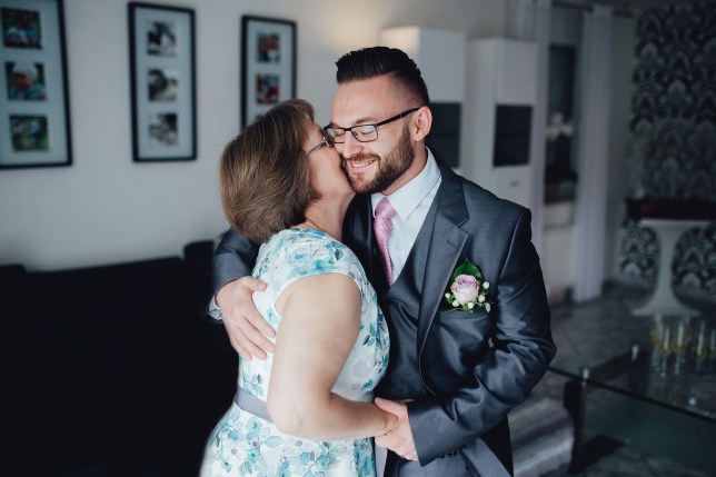 Portrait of a handsome groom with his mother.