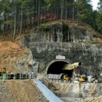 India: Rescuers dig by hand to reach workers in tunnel