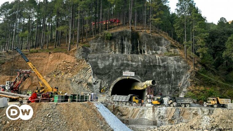 India: Rescuers dig by hand to reach workers in tunnel