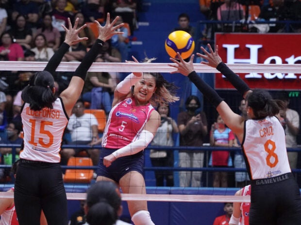 Creamline’s Risa Sato (center) fires a kill against the Farm Fresh wall. —AUGUST DELA CRUZ