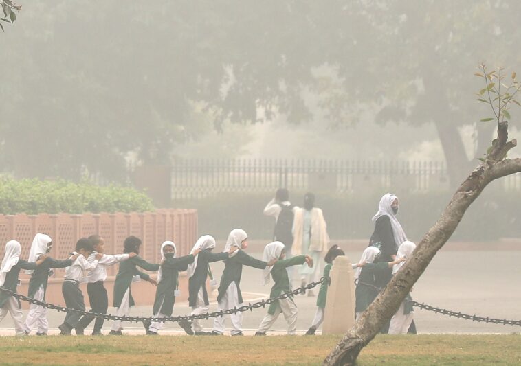 Photos: Smog-hit New Delhi extends school shutdown