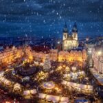 View of the old town square of Prague, Czech Republic, with the traditional Christmas Market and snowfall