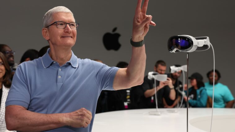 Apple's stock underperformed top tech peers in 2023 due to longest revenue slide in 22 years