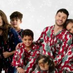 Families wearing matching Christmas pyjamas