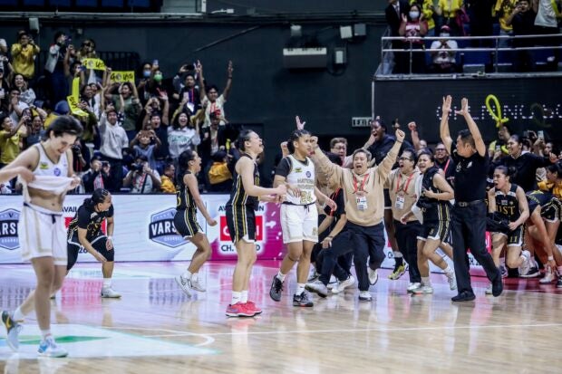 Coach Haydee Ong,  Tantoy Ferrer and the UST Growling Tigers celebrate UAAP Season 86 women's basketball title. –MARLO CUETO/INQUIRER.net