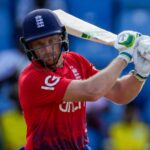 England's captain Jos Buttler plays a shot from the bowling of West Indies' Akeal Hosein..during the third T20 cricket match at National Cricket Stadium in Saint George's, Grenada, Saturday, Dec. 16, 2023. (AP Photo/Ricardo Mazalan)