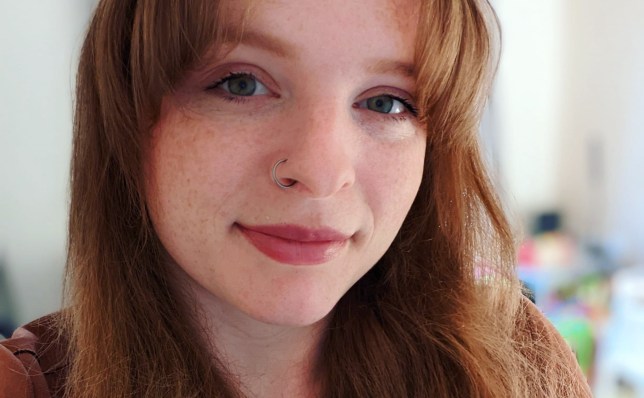 Close up selfie of Britt, with red hair, freckles and a nose ring