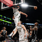 Milwaukee Bucks forward Giannis Antetokounmpo (34) blocks the shot of Brooklyn Nets forward Dariq Whitehead, right, during the second half of an NBA basketball game in New York, Wednesday, Dec. 27, 2023.