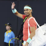 Rafael Nadal of Spain waves to the crowd in his doubles match against Australia's Max Purcell and Jordan Thompson during the Brisbane International tennis tournament in Brisbane, Australia, Sunday, Dec. 31, 2023.