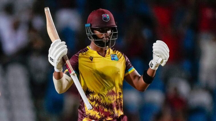 West Indies' Shai Hope celebrates hitting a six from a delivery of England's Chris Woakes..to win by 4 wickets the fifth T20 cricket match at Brian Lara Stadium in Tarouba, Trinidad and Tobago, Thursday, Dec. 21, 2023. (AP Photo/Ricardo Mazalan)