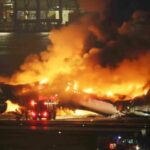 A Japan Airlines (JAL) passenger plane bursts into flames on the tarmac at Haneda Airport in Tokyo, Japan.