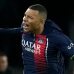 PSG's Kylian Mbappe celebrates after scoring his side's first goal from the penalty spot during the Champions League group F soccer match between Paris Saint-Germain and Newcastle United FC at the Parc des Princes in Paris, Tuesday, Nov. 28, 2023. (AP Photo/Christophe Ena)