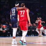 INDIANAPOLIS, INDIANA - FEBRUARY 18: Bam Adebayo #13 of the Miami Heat and Eastern Conference All-Stars and Luka Doncic #77 of the Dallas Mavericks and Western Conference All-Stars embrace on the court in the third quarter during the 2024 NBA All-Star Game at Gainbridge Fieldhouse on February 18, 2024 in Indianapolis, Indiana. NOTE TO USER: User expressly acknowledges and agrees that, by downloading and or using this photograph, User is consenting to the terms and conditions of the Getty Images License Agreement. (Photo by Stacy Revere/Getty Images)