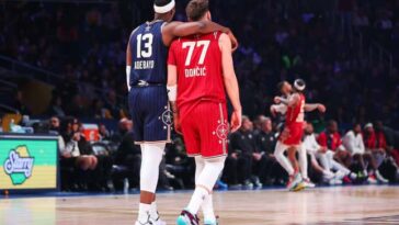 INDIANAPOLIS, INDIANA - FEBRUARY 18: Bam Adebayo #13 of the Miami Heat and Eastern Conference All-Stars and Luka Doncic #77 of the Dallas Mavericks and Western Conference All-Stars embrace on the court in the third quarter during the 2024 NBA All-Star Game at Gainbridge Fieldhouse on February 18, 2024 in Indianapolis, Indiana. NOTE TO USER: User expressly acknowledges and agrees that, by downloading and or using this photograph, User is consenting to the terms and conditions of the Getty Images License Agreement. (Photo by Stacy Revere/Getty Images)