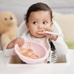 Shot of a baby eating a meal at home