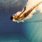 woman diving underwater