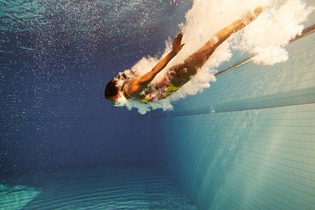 woman diving underwater