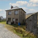 FILE PHOTO - Three Blea Moor Cottages in the Yorkshire Dales. See SWNS story SWLShouse. A derelict cottage next to England's most remote signal box has gone up for sale for ?300, 000.The three-bedroom property is next to the Blea Moor signal box on the Settle to Carlisle train line and is not accessible by road.Pictures show how the former railway worker's cottage is surrounded completely by the rolling hills of the Yorkshire Dales. Despite the whopping price tag, the property is in need of an extensive renovation, with the walls being completely bare.