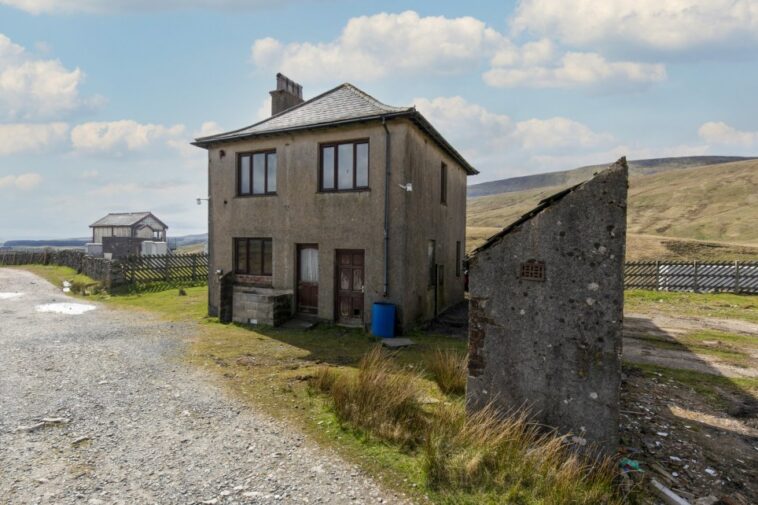 FILE PHOTO - Three Blea Moor Cottages in the Yorkshire Dales. See SWNS story SWLShouse. A derelict cottage next to England's most remote signal box has gone up for sale for ?300, 000.The three-bedroom property is next to the Blea Moor signal box on the Settle to Carlisle train line and is not accessible by road.Pictures show how the former railway worker's cottage is surrounded completely by the rolling hills of the Yorkshire Dales. Despite the whopping price tag, the property is in need of an extensive renovation, with the walls being completely bare.