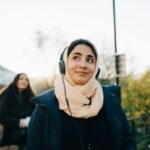 Muslim woman listening to her headphones