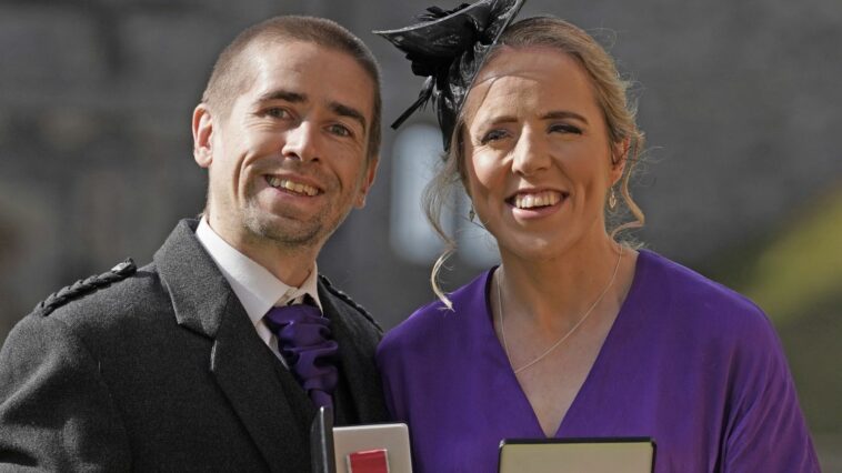 Lora and Neil Fachie receiving their OBEs at Windsor Castle in October 2023